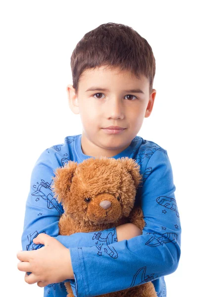 Boy hugging a teddy bear — Stock Photo, Image