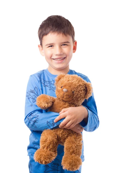 Хлопчик обіймає плюшевого ведмедя — стокове фото