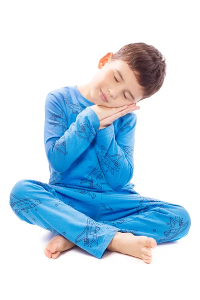 Niño en pijama sobre fondo blanco —  Fotos de Stock