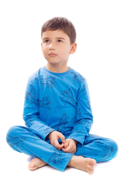 Мальчик в пижаме на белом фоне Стоковое Изображение