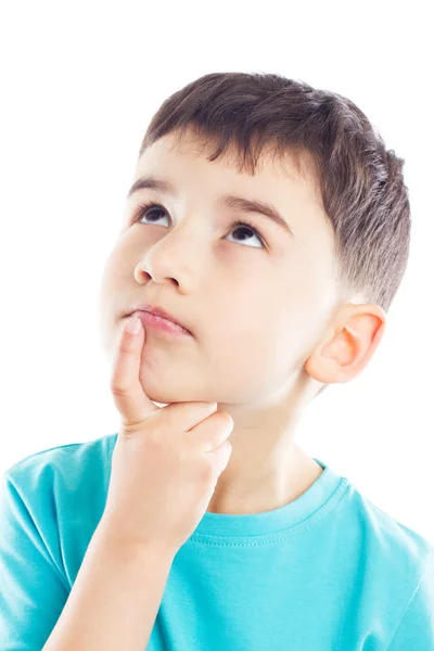 Thoughtful boy with finger on chin — Stock Photo, Image