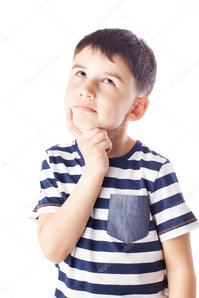 Thoughtful boy with finger on chin