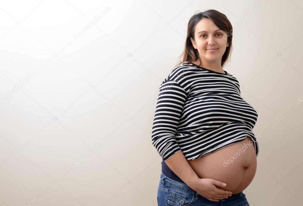 Calm expecting woman with copy space