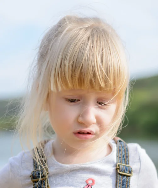 Gentle breeze tussles the hair of blond youngster — Stock Photo, Image