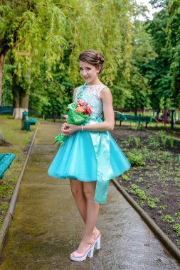 Cute girl in beauty pageant outfit outside clipart