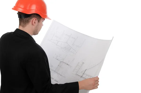 Young engineer consulting a building plan — Stock Photo, Image