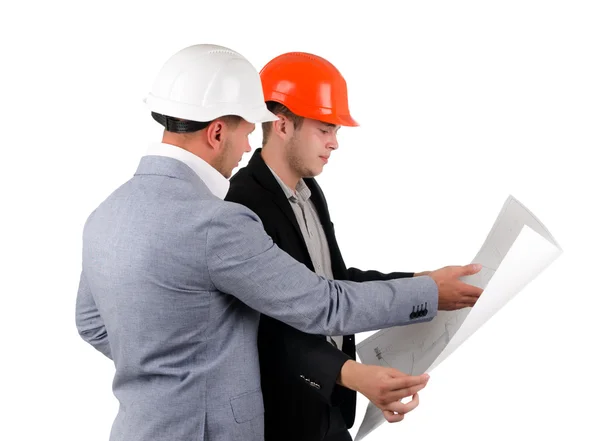 Dois arquitetos discutindo um plano de construção — Fotografia de Stock