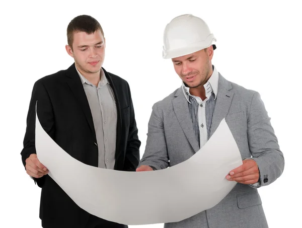 Architect discussing a blueprint with his partner — Stock Photo, Image