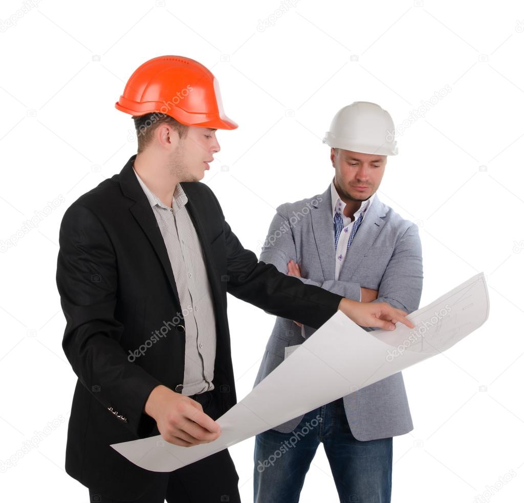 Two architects looking at a building plan