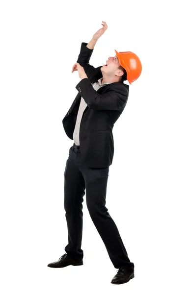 Cowering homem vestindo terno e chapéu duro — Fotografia de Stock