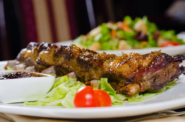 Rack of Grilled Pork Ribs on Plate in Restaurant — Stok Foto