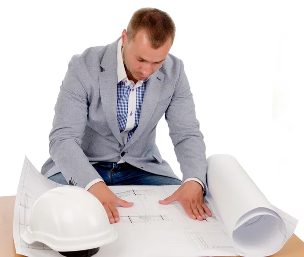 Architect or engineer studying building plans — Stock Photo, Image