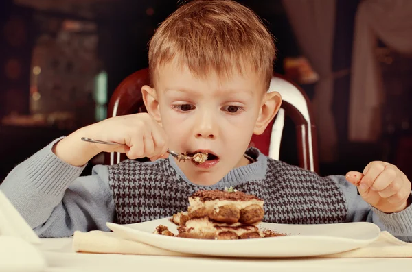 Little boy licking his fingers in appreciation — Stock Photo, Image