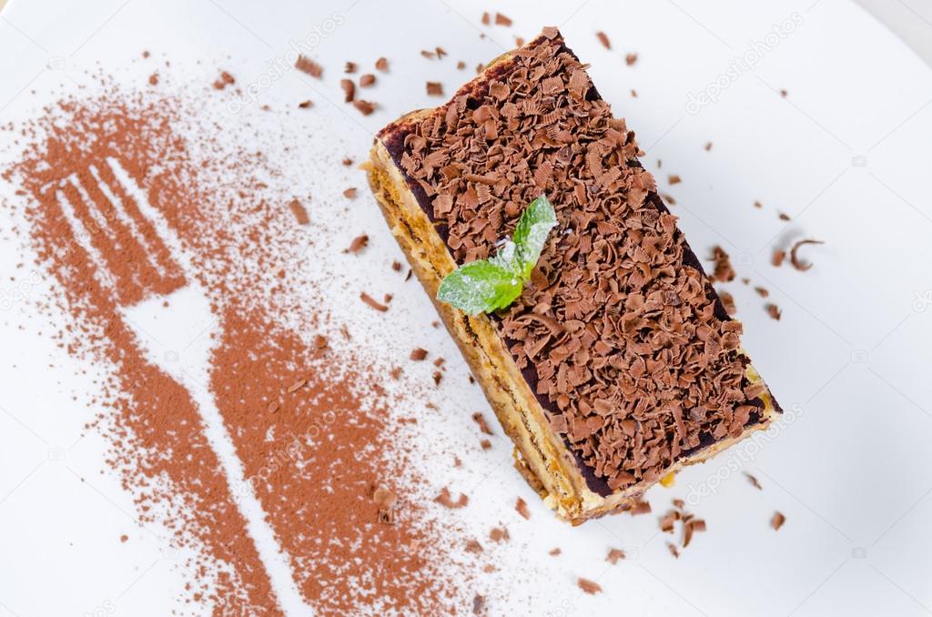 Slice of Delicious Cake with Chocolate Shavings