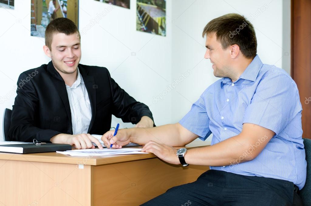 Salesman or real estate agent signing a deal