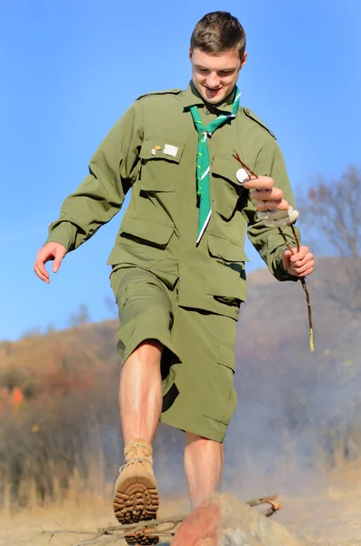 Boy Scout Breaking Wood for Campfire — Stock Photo, Image