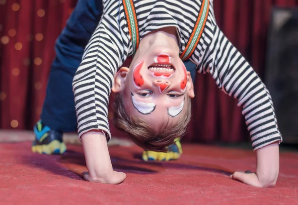 Supple agile little boy doing a back arch — Stock Photo, Image