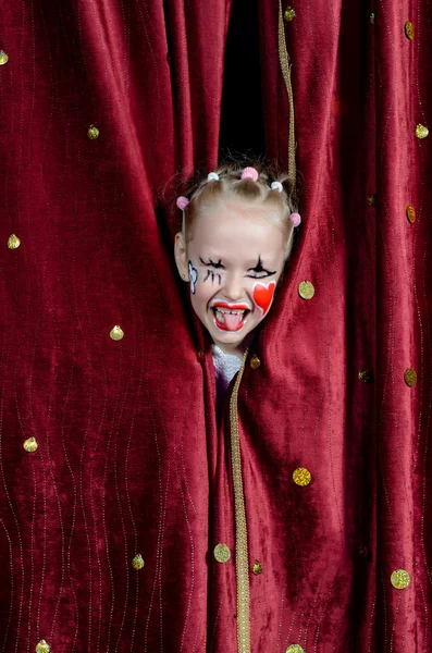 Girl Wearing Clown Makeup Peeking Through Curtains — Stock Photo, Image