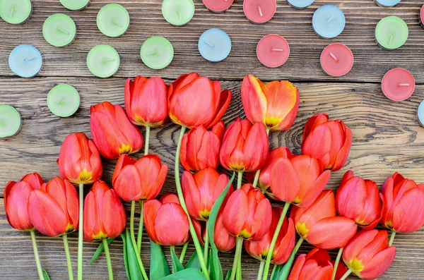 Tulips and candles — Stock Photo, Image