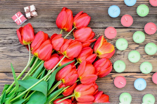 Tulips and candles — Stock Photo, Image