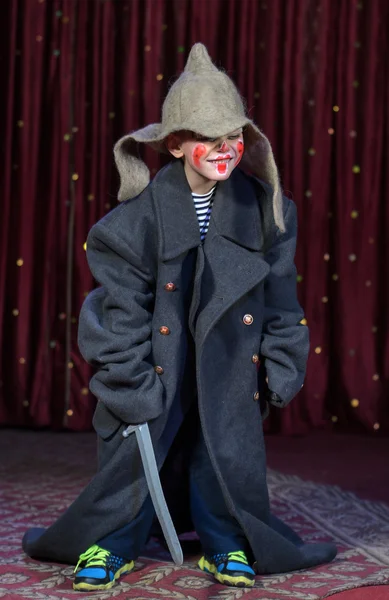 Boy Wearing Over Sized Coat Wearing Clown Make Up