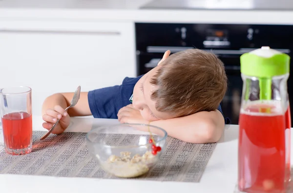 Bored young boy waiting for his meal — Stock Photo, Image