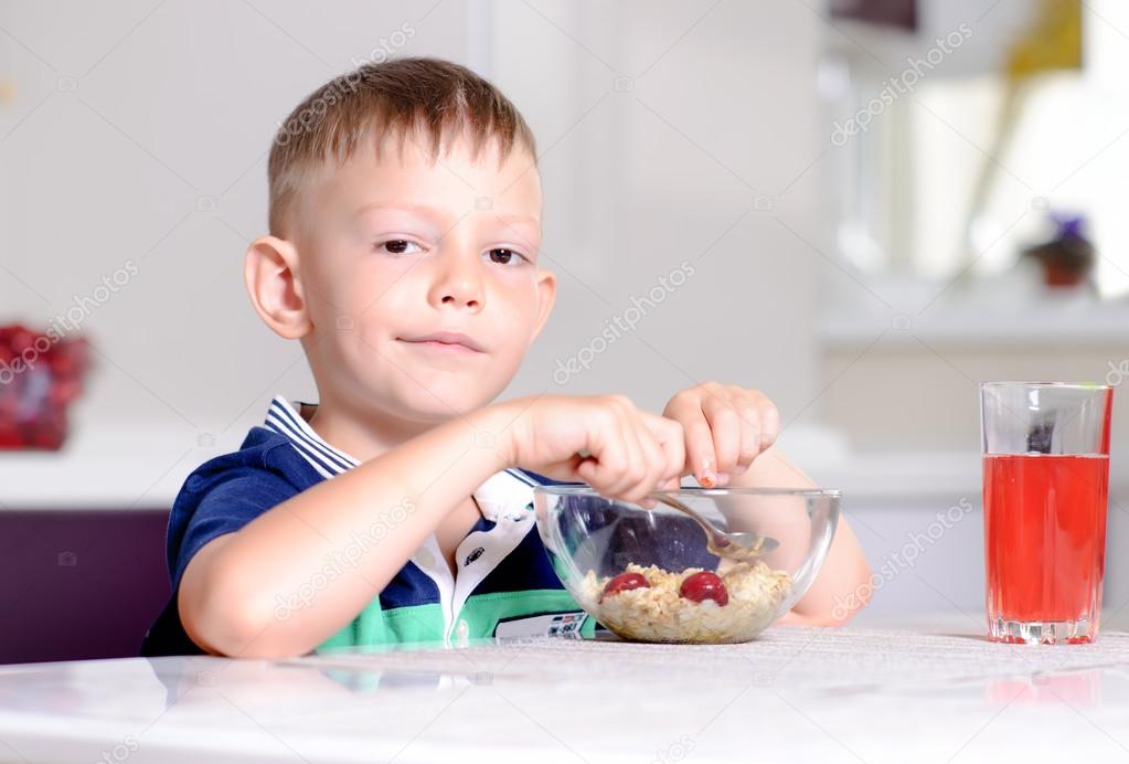 Boy Eating Bowl of Cereal for Breakfast