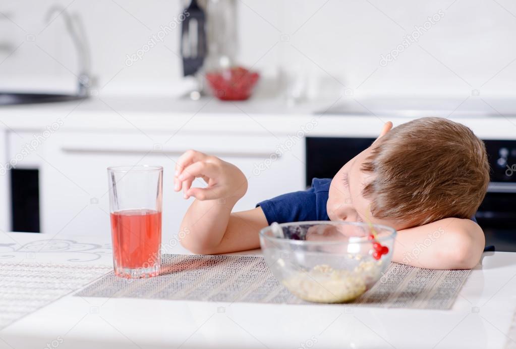 Young boy waiting patiently for his lunch