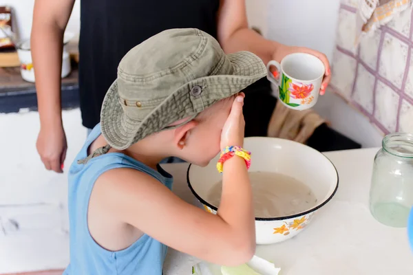 Young Boy Washing his Face with Water on a Basin — Stock Photo, Image