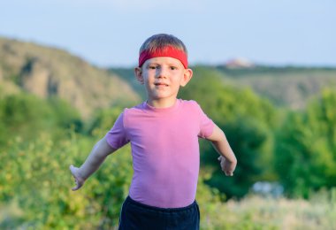 Happy Kid Practicing Martial Arts Moves Outdoor