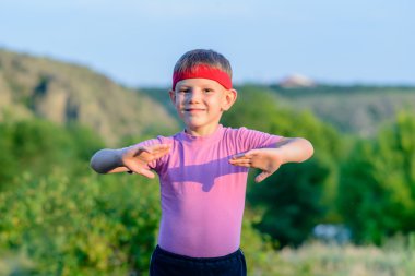 Happy Kid Practicing Martial Arts Moves Outdoor