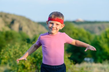 Happy Kid Practicing Martial Arts Moves Outdoor