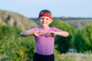 Happy Kid Practicing Martial Arts Moves Outdoor