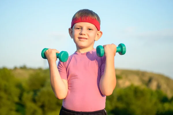 Athletic Cute Boy Lifting Two Small Dumbbells — Stock Photo, Image