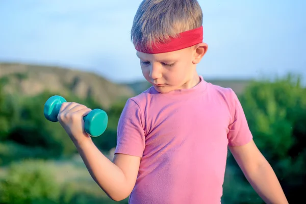 Close up Thoughtful Young Boy Lifting Dumbbell — Stok fotoğraf