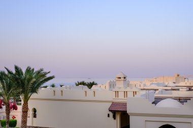 Sunset over a tropical resort complex
