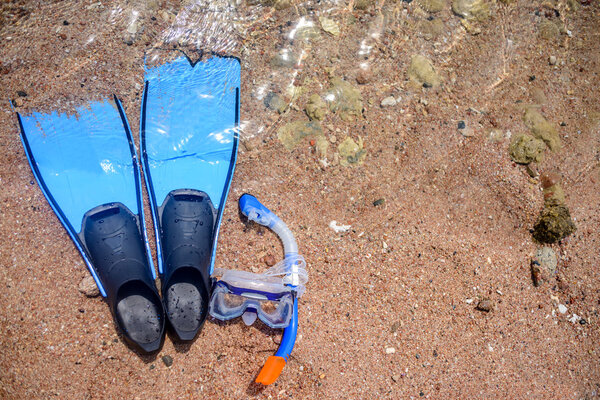 Skin diving gear lying on a beach