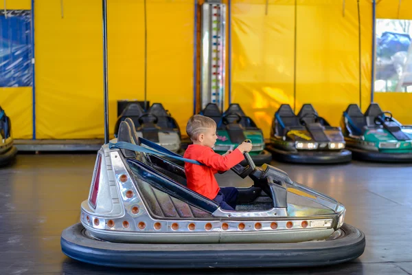 Stock image Young boy playing in a bumper car