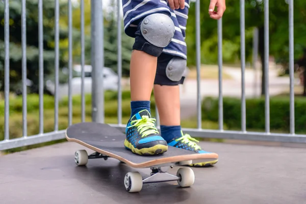 Young boy with his skateboard on a ramp — Stock Photo, Image