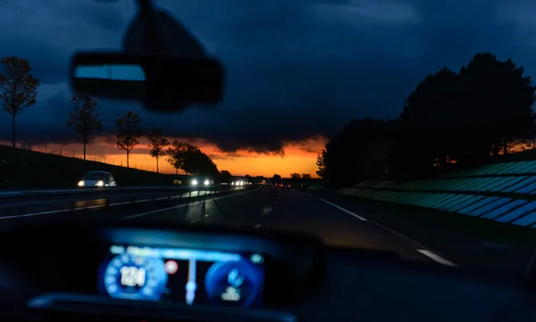 Driving at night at sunset — Stock Photo, Image