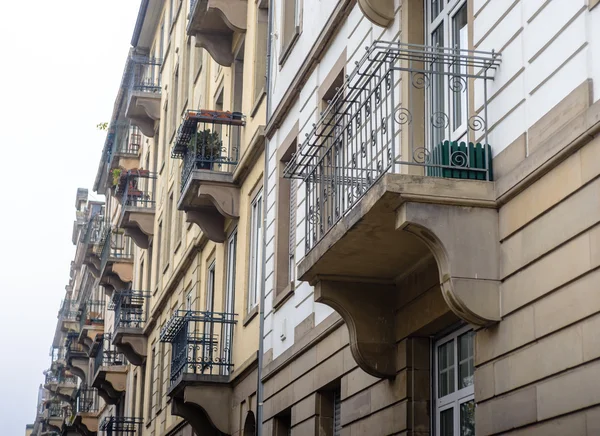 Facade of old European building with balcony autumn — Stock Photo, Image