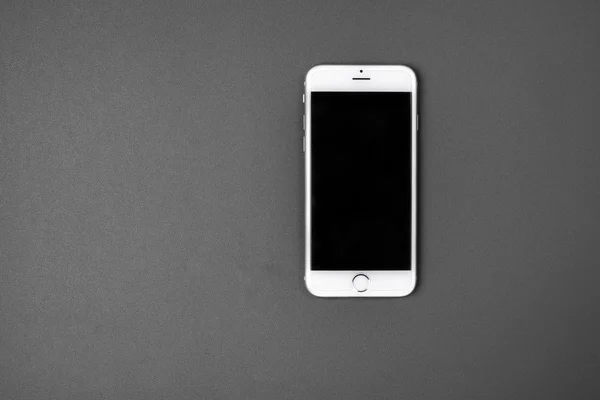 Blank smart phone on grey background — Stock Photo, Image