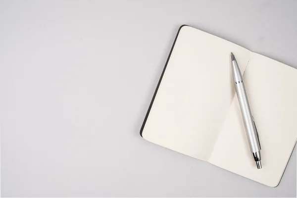 Open notebook with pen — Stock Photo, Image