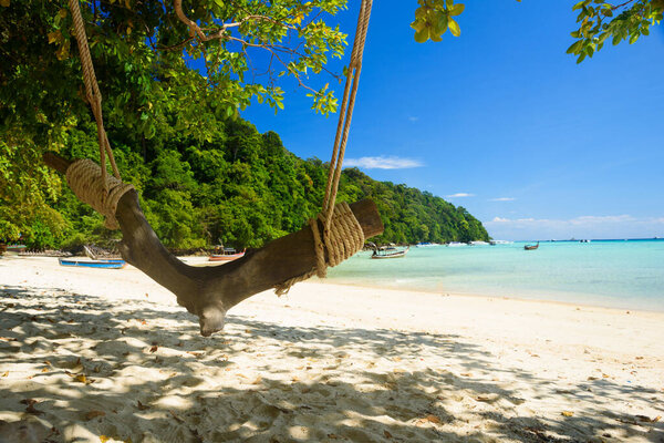 A wooden swing on the beach. Beautiful beach and blue sky at Surin island national park