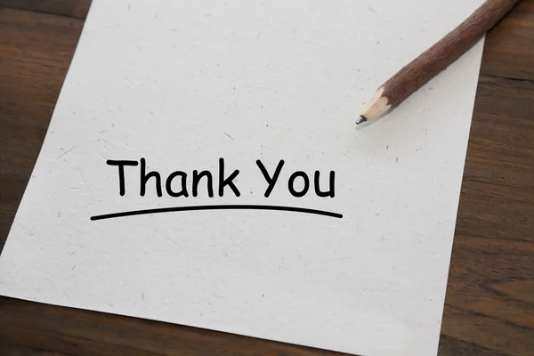 Pencil with word thank you on old wood table — Stock Photo, Image