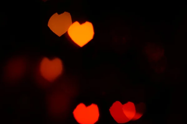 Bokeh rouge orange en forme de coeur — Photo