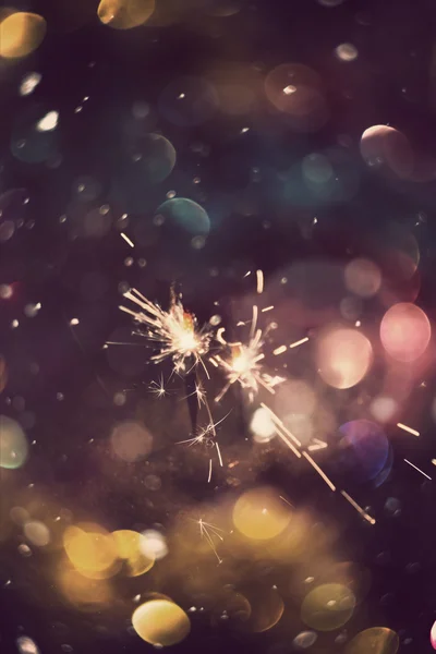 Sparkler and Colorful Bokeh — Stock Photo, Image