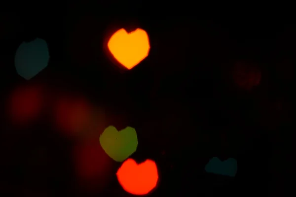 Красный оранжевый боке в форме сердца — стоковое фото