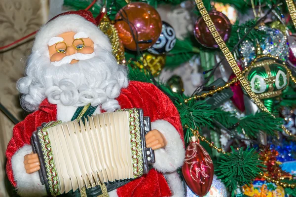 Santa hračka s akordeonem — Stock fotografie