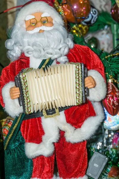 Brinquedo santa com acordeão — Fotografia de Stock